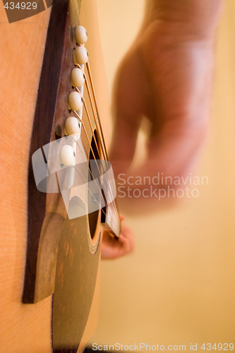 Image of Playing guitar