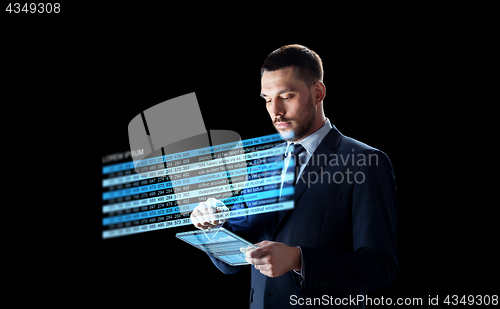 Image of businessman with tablet pc and stock charts