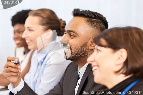 Image of happy business team at international conference