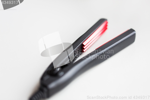 Image of mini crimper on white background