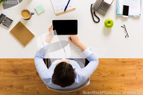 Image of businesswoman with tablet pc at office