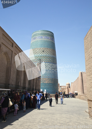 Image of KHIVA, UZBEKISTA,N - MAY 01, 2014: Street of Khiva with Kalta Minor Minaret vew