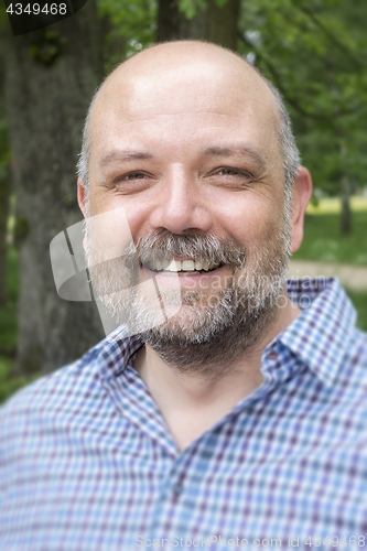 Image of handsome bearded man portrait outdoors