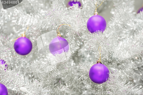 Image of Red baubles on silver artificial christmas tree