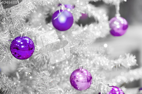 Image of Red baubles on silver artificial christmas tree