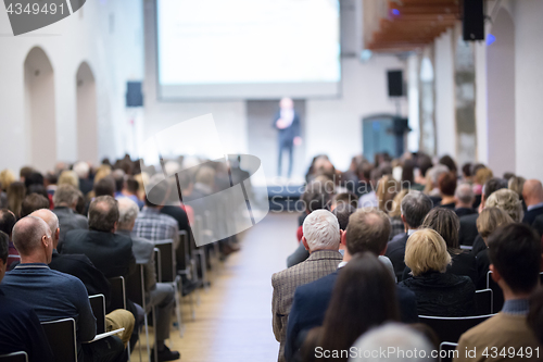 Image of Business speaker giving a talk at business conference event.