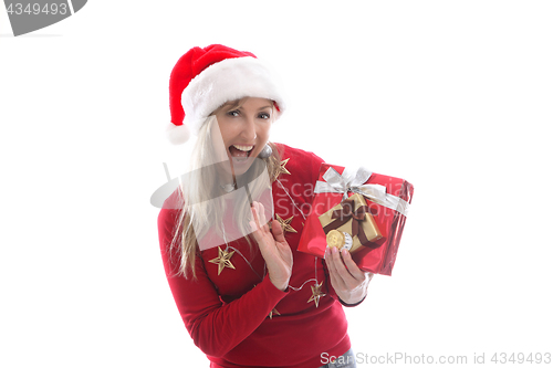 Image of Festive woman at Christmas. she is holding crypto currency coins and a present