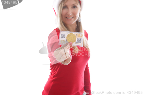 Image of Woman holding crypto coins and paper wallet