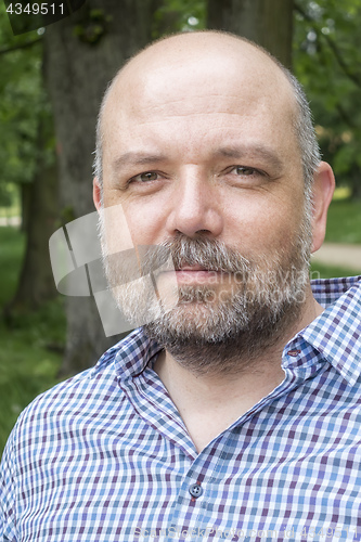 Image of handsome bearded man portrait outdoors