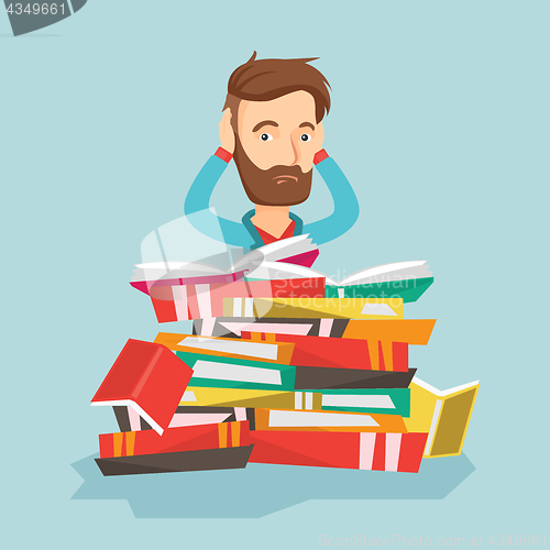 Image of Student sitting in huge pile of books.