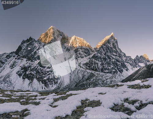 Image of Taboche and Cholatse summits and sunrise