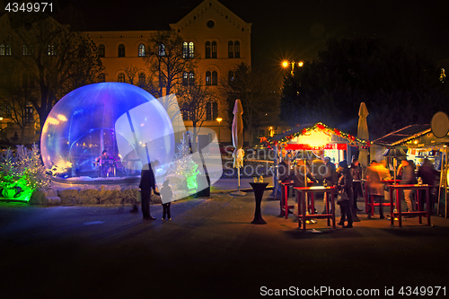 Image of Christmas snow globe in which the music player as part of Advent