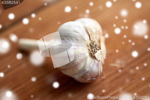 Image of close up of garlic on wooden table