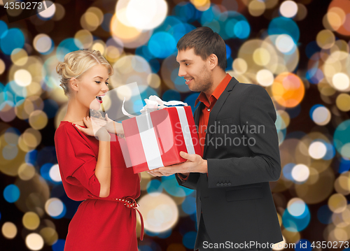 Image of happy couple with christmas gift