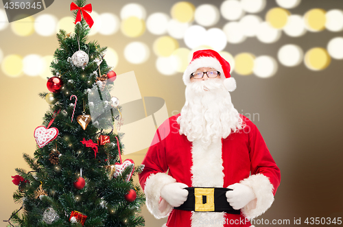 Image of santa claus at christmas tree