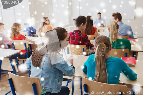 Image of student girl cheating at school test