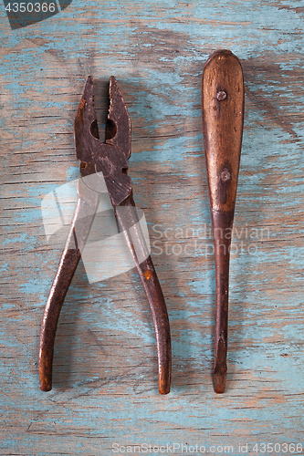 Image of Vintage tools on a blue wooden background