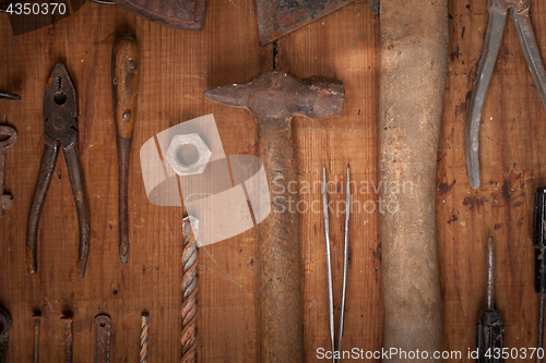 Image of Collection of vintage tools on wooden background
