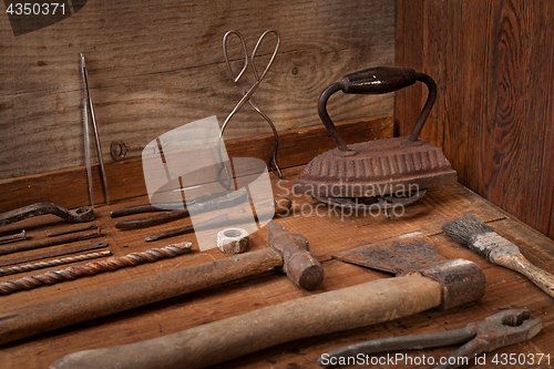 Image of Collection of vintage tools on a blue wooden background