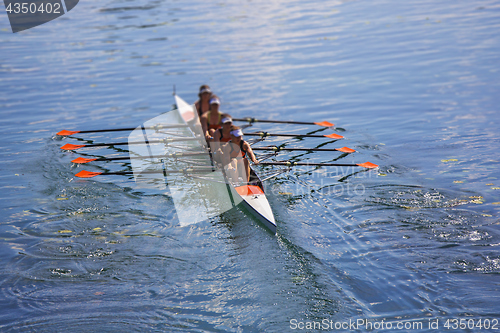 Image of Team of rowing Four-oar women in boat 