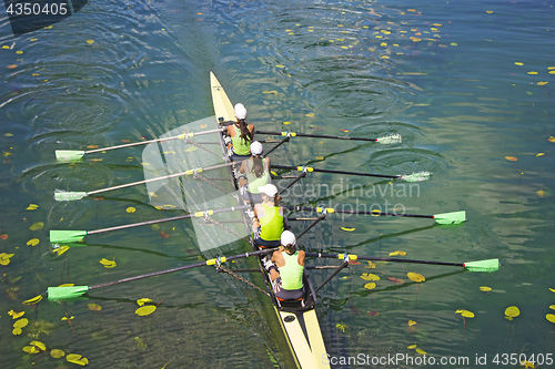 Image of Team of rowing Four-oar women in boat 