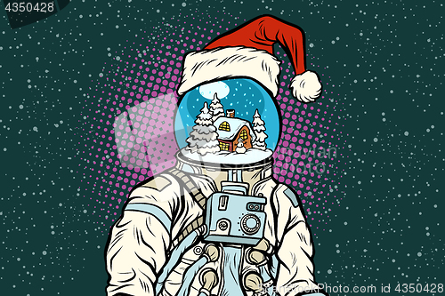 Image of Christmas astronaut with dreams of gingerbread house