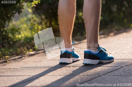 Image of woman jogging at sunny morning