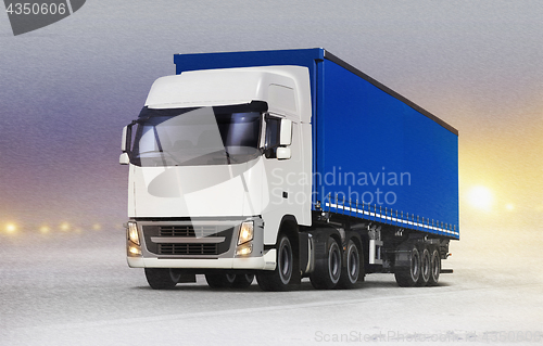 Image of truck on ice road in snow-storm 