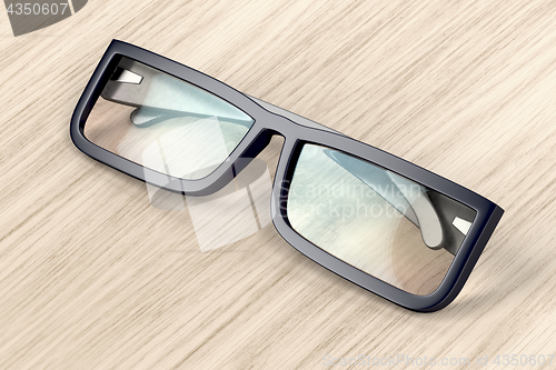 Image of Eyeglasses on wood background