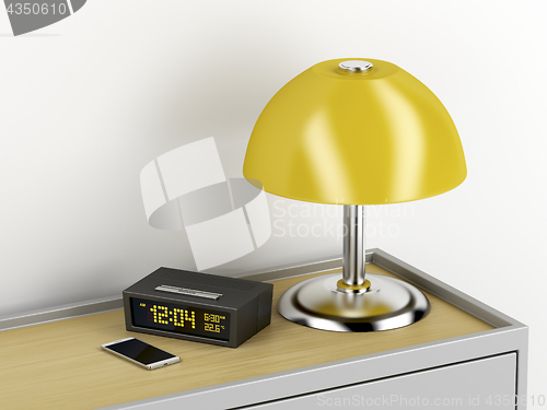 Image of Nightstand with electric devices on it