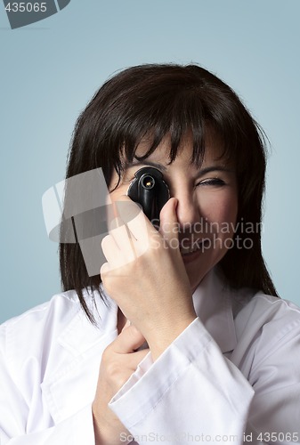 Image of Eye doctor using opthalmoscope