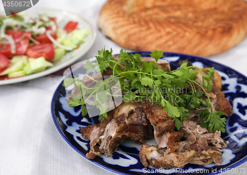 Image of Traditional Uzbek meal with lamb meat and lavash