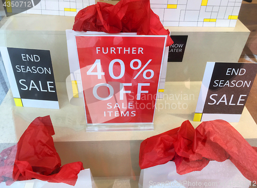 Image of Sales signs in a window shop display
