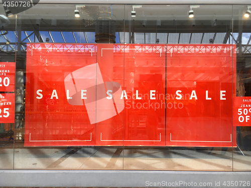 Image of Large Sale Banners hanging in show window display