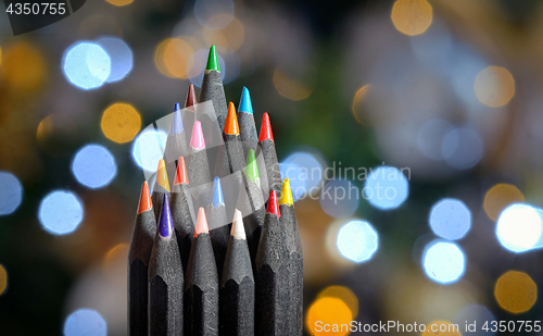 Image of Christmas tree made of wooden pencils