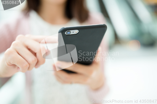 Image of Woman hold with mobile phone