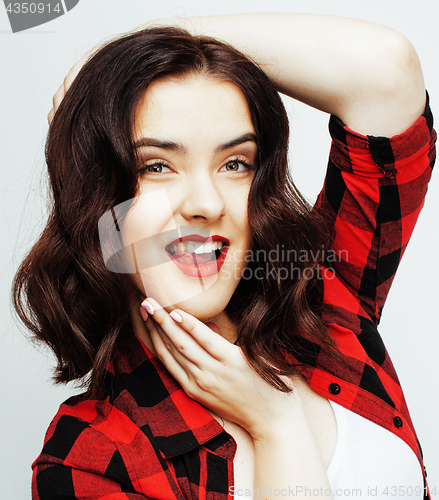 Image of young pretty stylish brunette hipster girl posing emotional isolated on white background happy smiling cool smile, lifestyle people concept 