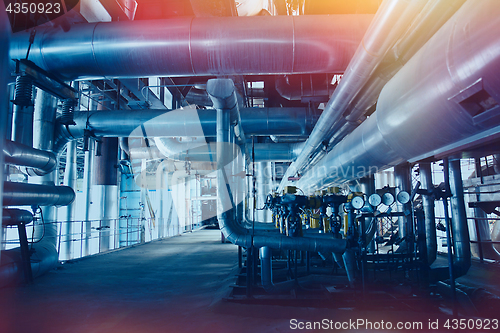 Image of Equipment, cables and piping as found inside of a modern industr