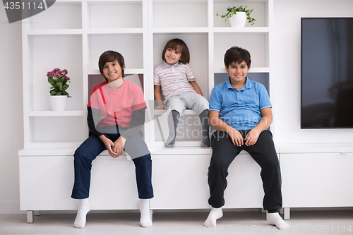 Image of young boys posing on a shelf