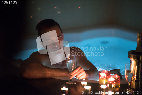 Image of man relaxing in the jacuzzi