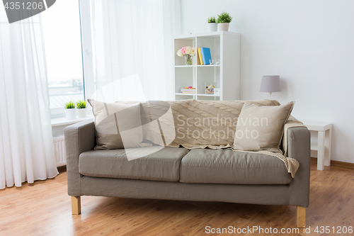 Image of sofa with cushions at cozy home living room