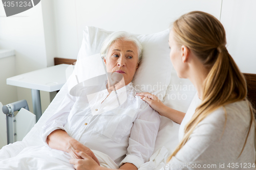 Image of daughter visiting her senior mother at hospital