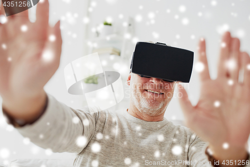 Image of old man in virtual reality headset or glasses