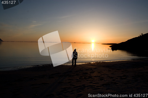 Image of Person at a beach during sunset