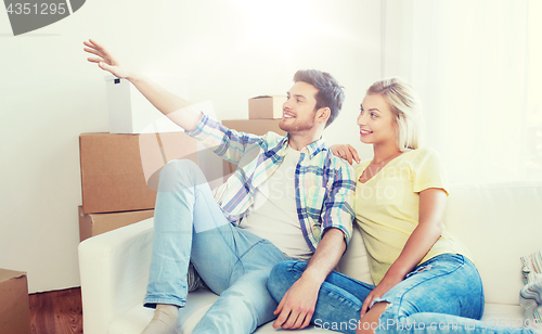 Image of couple with boxes moving to new home and dreaming