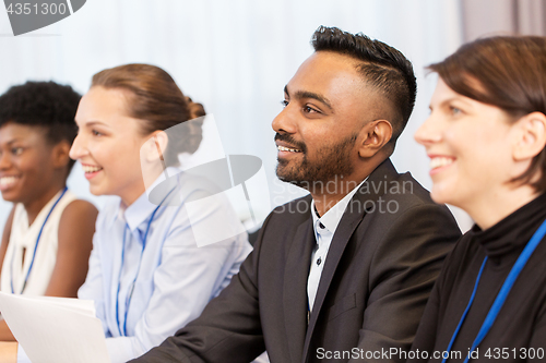 Image of happy business team at international conference