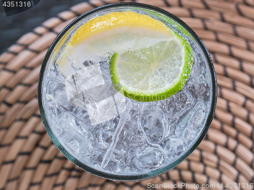 Image of Glass of soda water with ice and lime