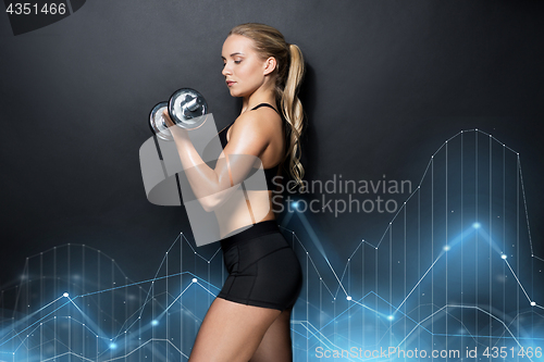 Image of young sporty woman exercising with dumbbell