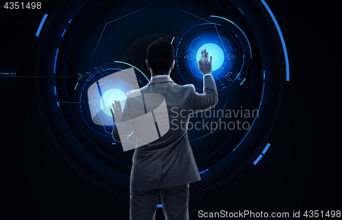 Image of businessman working with virtual reality screen