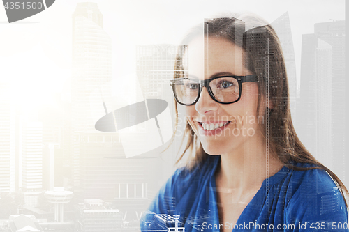 Image of close up of smiling middle aged woman in glasses